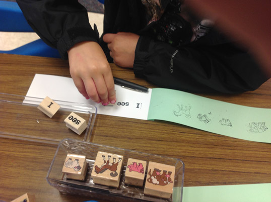 Kindergartners make stamp and read books