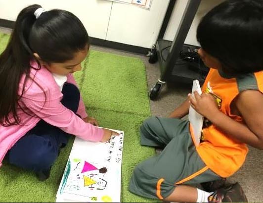 reading their published books to their kindergarten friends